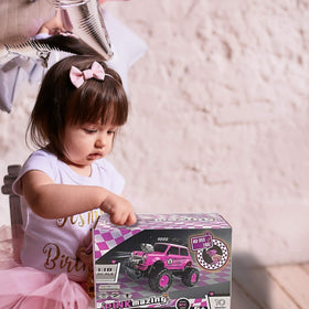10Leccion pink RC truck indoors and outdoors, versatile play setup.