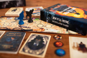 25th Century Games Jekyll Hyde trick-taking cards in focus for strategic cooperation.
