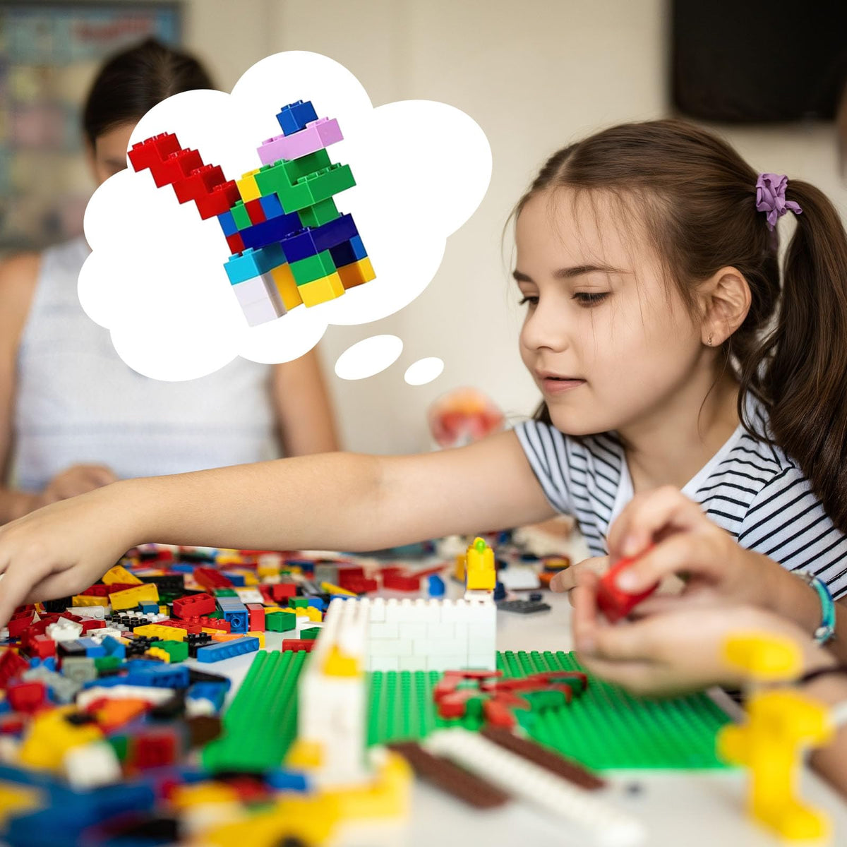 Kids building with 3 Otters blocks to boost collaboration and fine motor skills