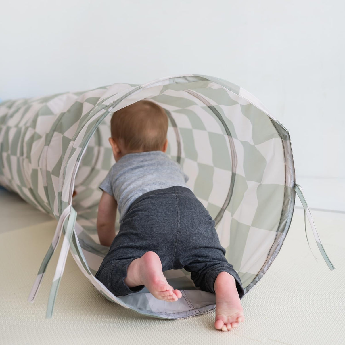 Multiple children enjoy 3 Sprouts tunnel for shared play