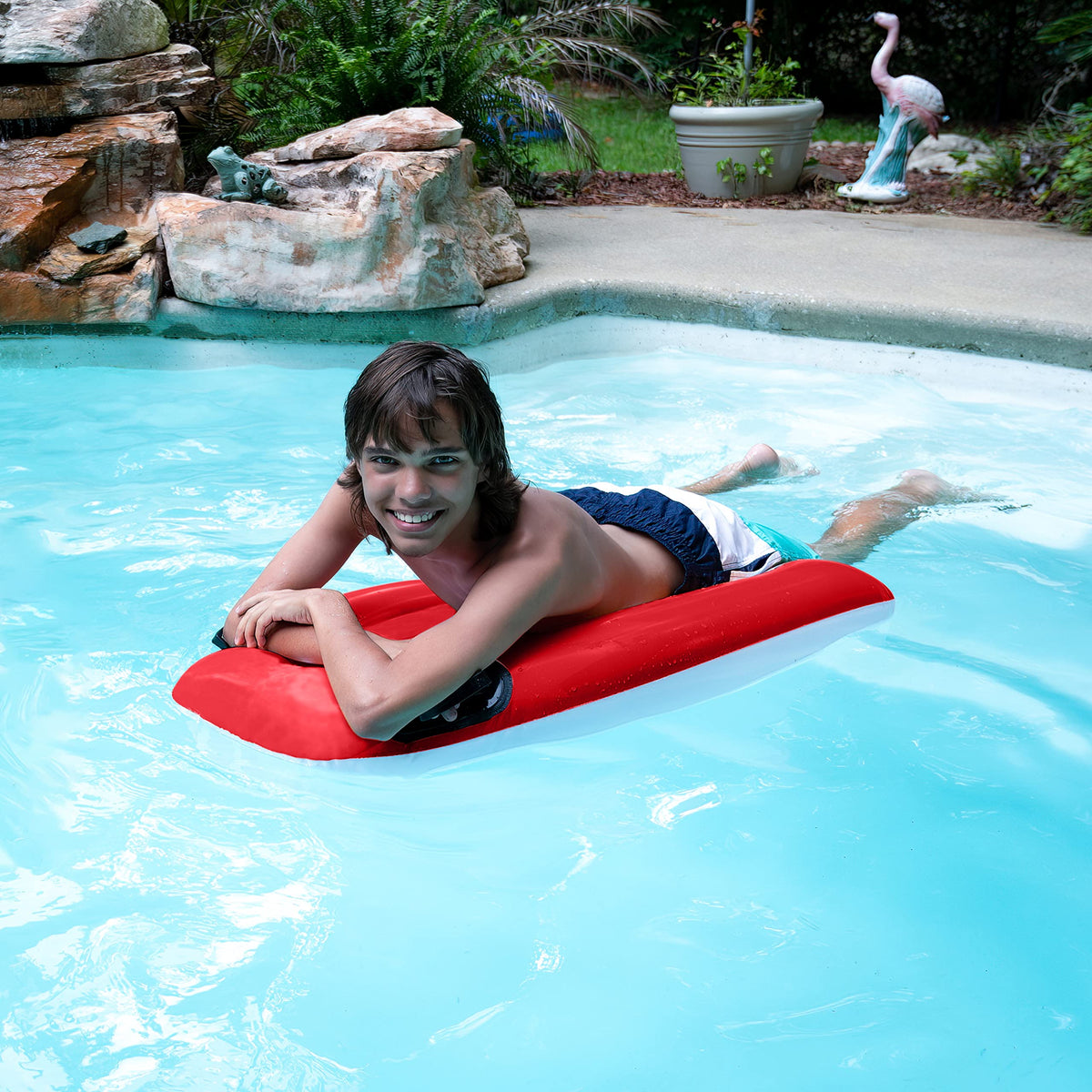 Bright red and blue wave design boogie board for kids' pool time.