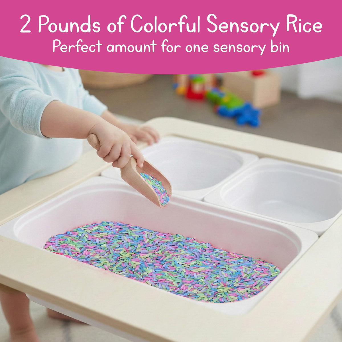 7 Days of Play scooping and pouring with pastel rice in a bin.