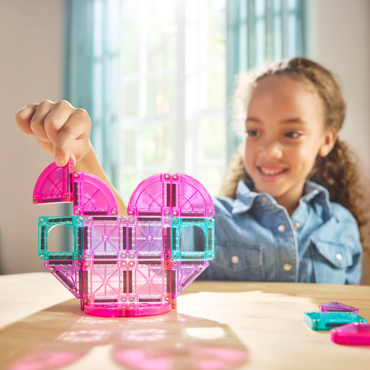 Magna-Tiles microMAGS arch windows add charm to kid-friendly constructions.