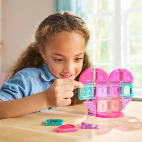 Magna-Tiles microMAGS quarter-circle pieces encourage curves and dynamic builds.