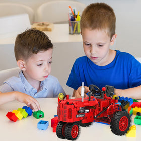 A XINAO TOYS Finished-tractor model on display inspires family playtime.