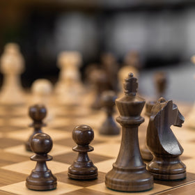 A&amp;A pieces arranged on a chessboard for a classic setup.