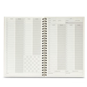 A&A scorebook grid lines keep notation neat during fast-paced games.