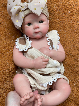 Close up of rosy cheeks and hand painted details on Abenduot Bettie Girl