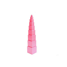 Adena Montessori Pink Tower being assembled by a child practicing fine motor skills.