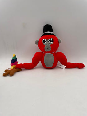 Adenzai Monkey Monkey Plush red being hugged by a child.