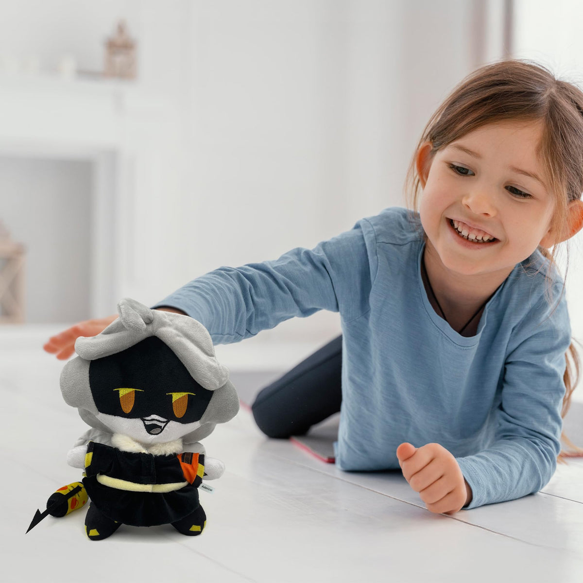 Adenzai plush doll close-up of stitched details and vibrant hues