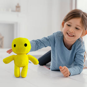 Adenzai Yellow Man plush in a gaming desk setup for decor appeal