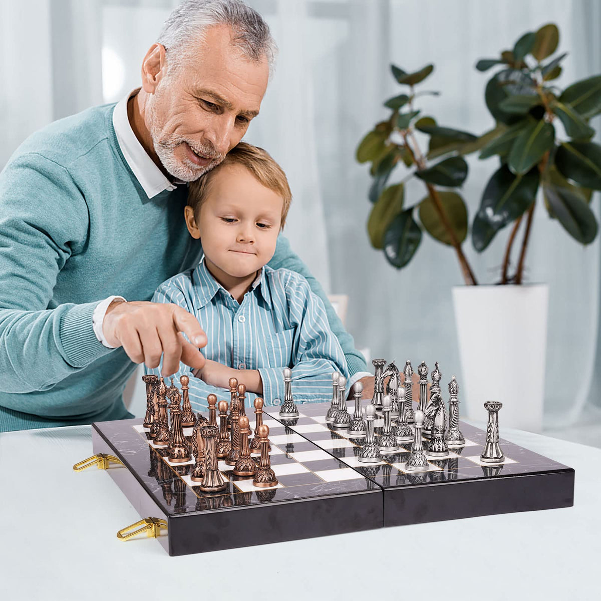 Agirlgle retro metal chess set on table ready to play.