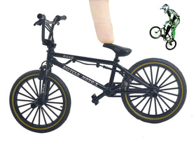 Ailejia BMX black finger bike on a desk serves as subtle decor.