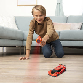 Air Hogs Zero Gravity Laser controller in hand for precise control.