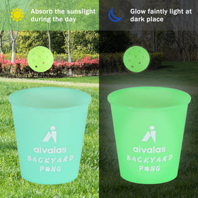 Aivalas glow balls glow after sunset for backyard games.