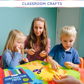 Alitte kids crafting with paper, perfect for imaginative art activities.