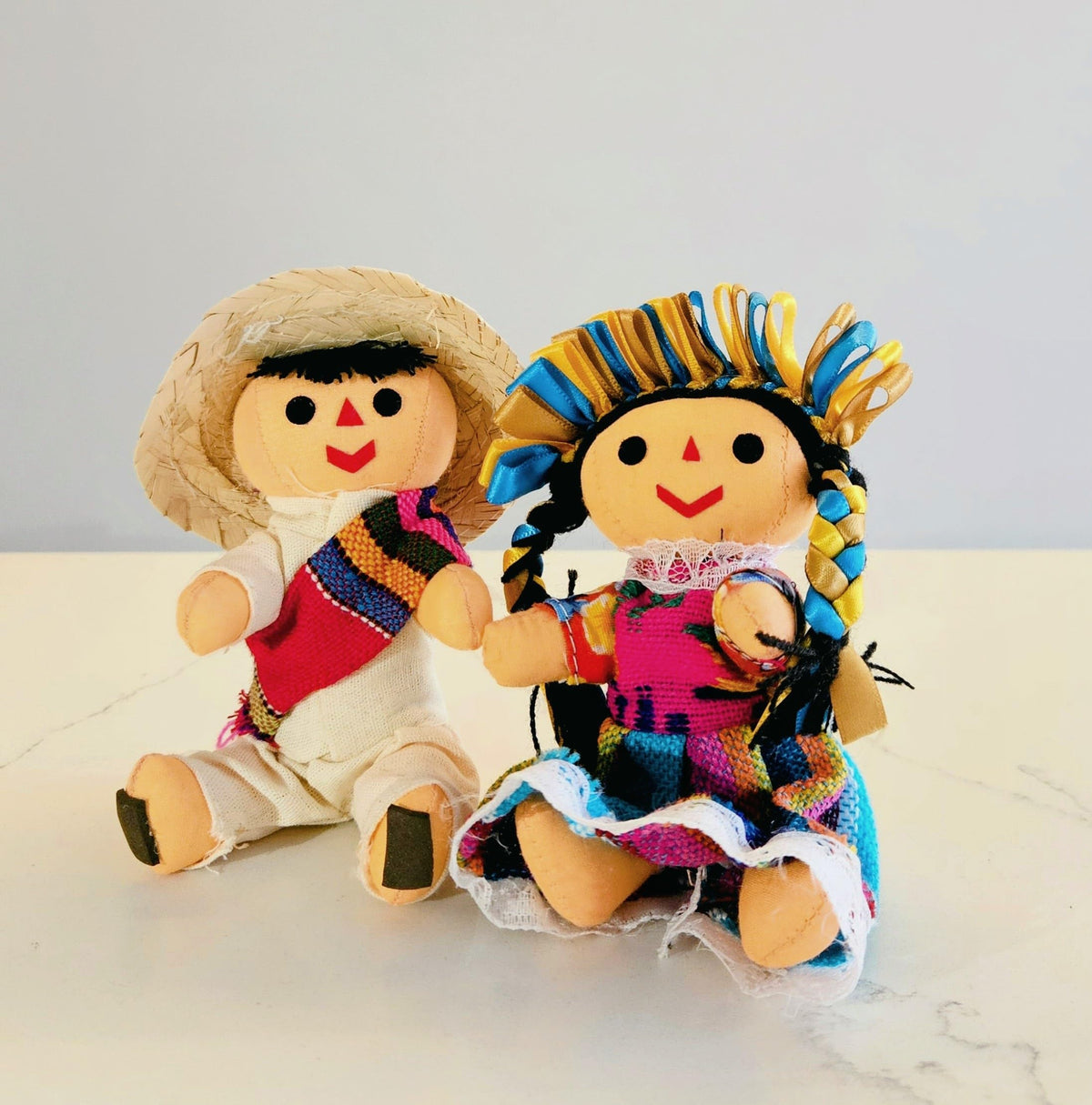 ALKIMIA INC Partner doll in manta shirt and sombrero enhances festive display.