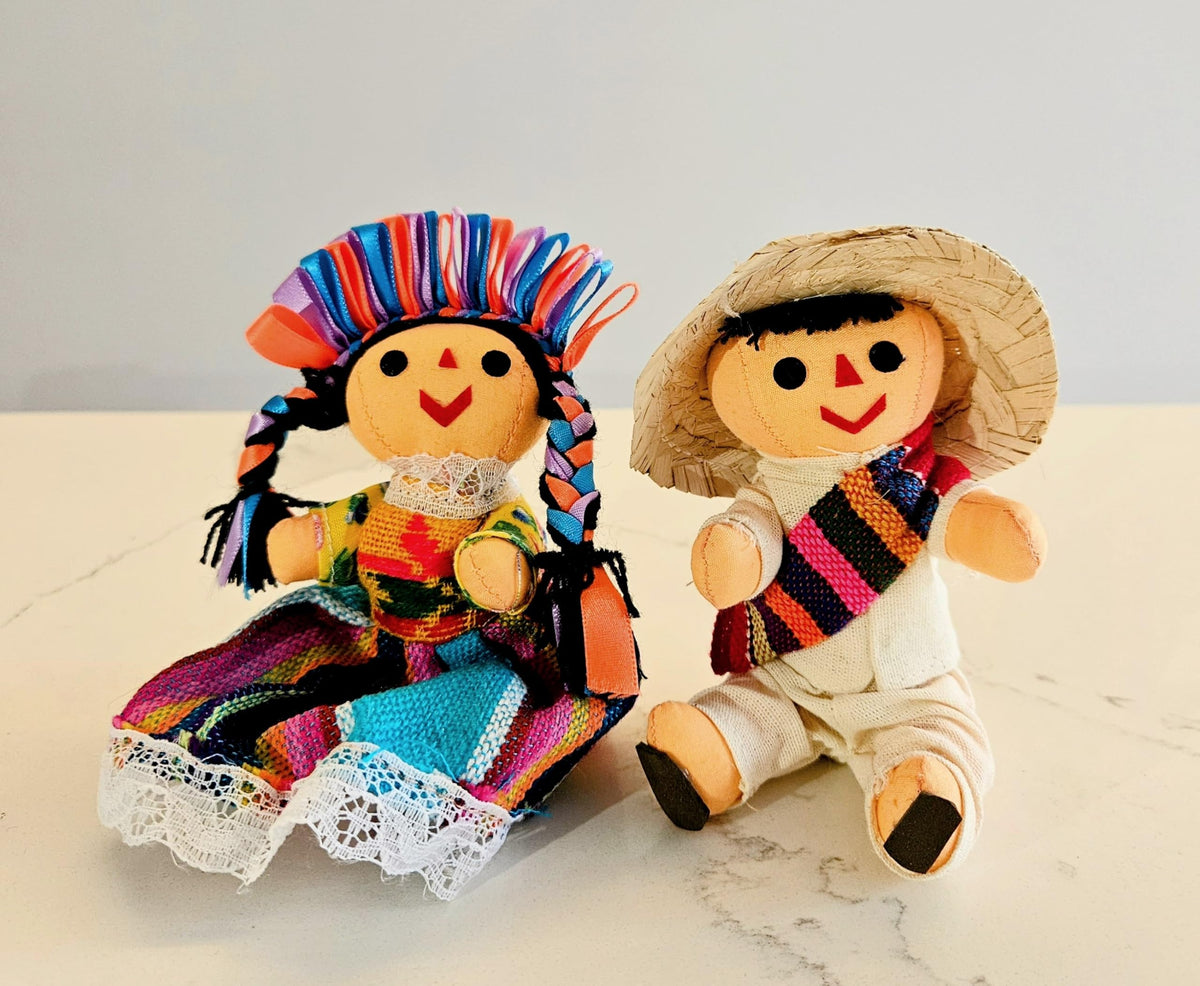 ALKIMIA INC Traditional rag dolls with bright dresses add cheerful charm.
