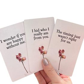 Hidden Truth Oracle cards fanned to reveal a 54-card love spread.