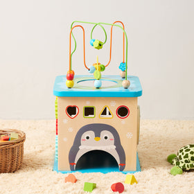 Amazon Basics wooden activity cube shape sorter side encourages color and shape recognition and sorting.