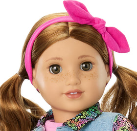 American Girl Lila pink bow headband completes the look