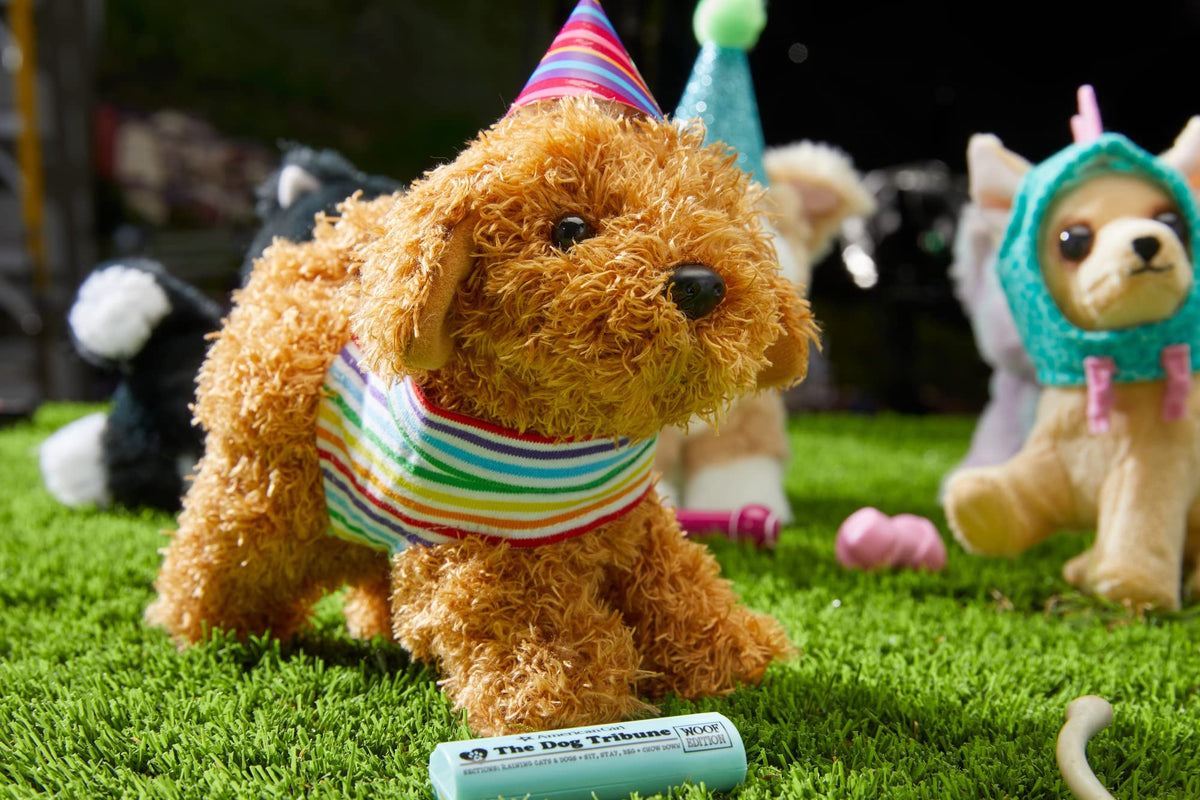 American Girl Daffodil Doodle Dog magnetic mouth shown holding the barbell toy during interactive play.