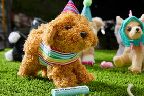American Girl Daffodil Doodle Dog magnetic mouth shown holding the barbell toy during interactive play.
