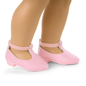 American Girl Truly Me light-pink headband complements pastel petals look.