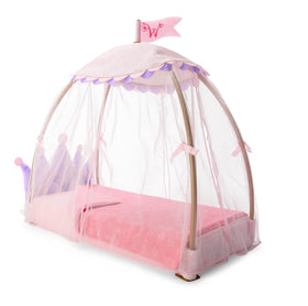Pink blanket with royal print adds cozy color to WellieWishers canopy bed.