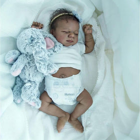 Anano black reborn doll close-up face with sleepy eyes for soothing pretend interactions.