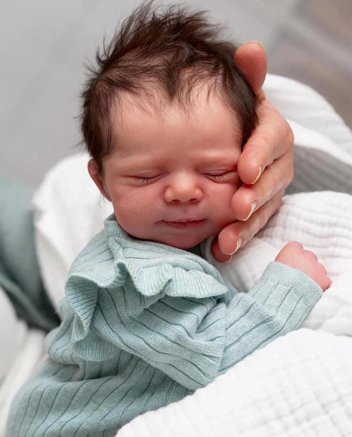 Anano Reborn 18-inch doll with hand-rooted hair ideal for realistic styling sessions.