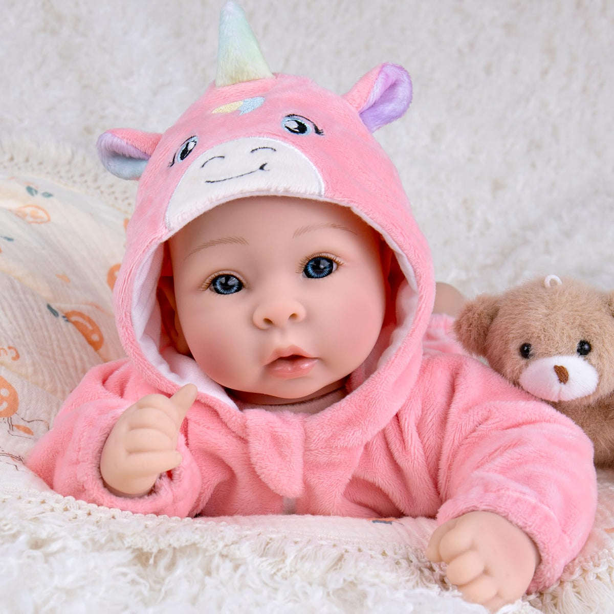 Aori 17-inch doll in soft body wearing pink outfit for cuddles.