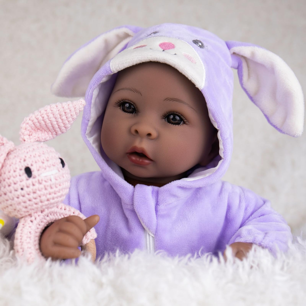 Aori Black Baby Doll 17-inch hand-painted details highlight realistic skin tone.