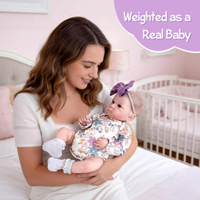 Aori Reborn Baby Doll dressed in newborn clothes for complete outfit playtime.