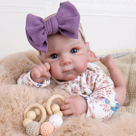 Aori Reborn Baby Doll hand-painted features enhancing lifelike charm for nurturing.