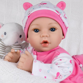 Aori Reborn Baby Dolls Girl pink onesie enhances nurturing play and cuddling moments.