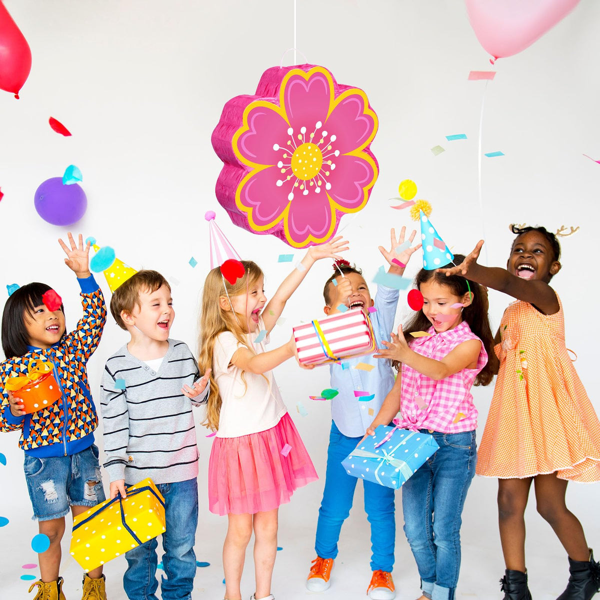 Aoriher boho pastel party scene with pinata decoration.