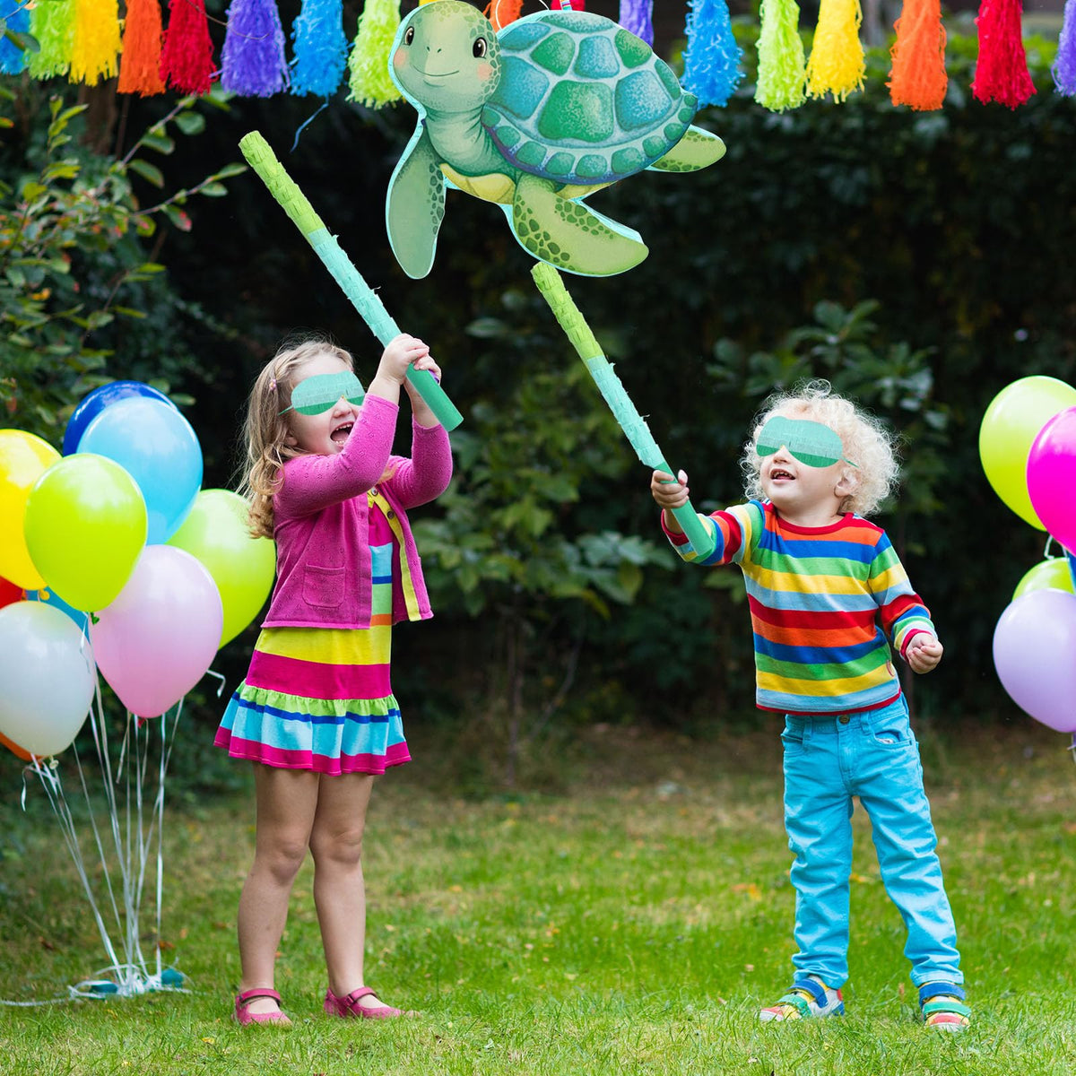 Aoriher sea turtle pinata features a green body with pink accents.