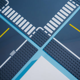 Apostrophe Games Road Base Plate Gray curve piece enables smooth road networks and creative layouts.