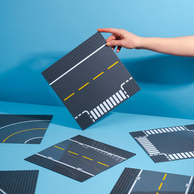 Apostrophe Games Road Base Plate Gray straight piece showing grid alignment for precise placement.