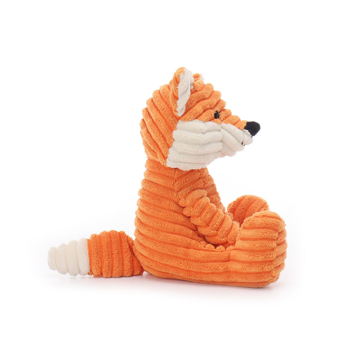 Apricot Lamb fox plush in a child's room enhancing decor with whimsy.