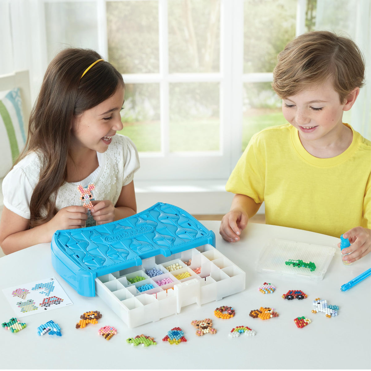 Included design templates and pins to spark creativity with Aquabeads.