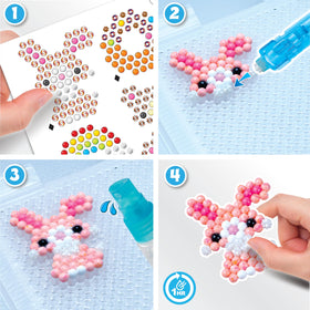 Aquabeads pop-up craft plate for easy layering and spray crafting.