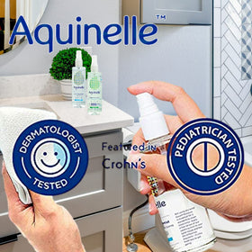 Aquinelle Toilet Tissue Mist folded-paper usage close-up highlighting soothing botanicals.