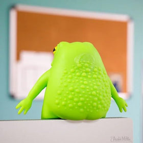 Archie McPhee Splat Frog on desk for reshaping play and stress relief.