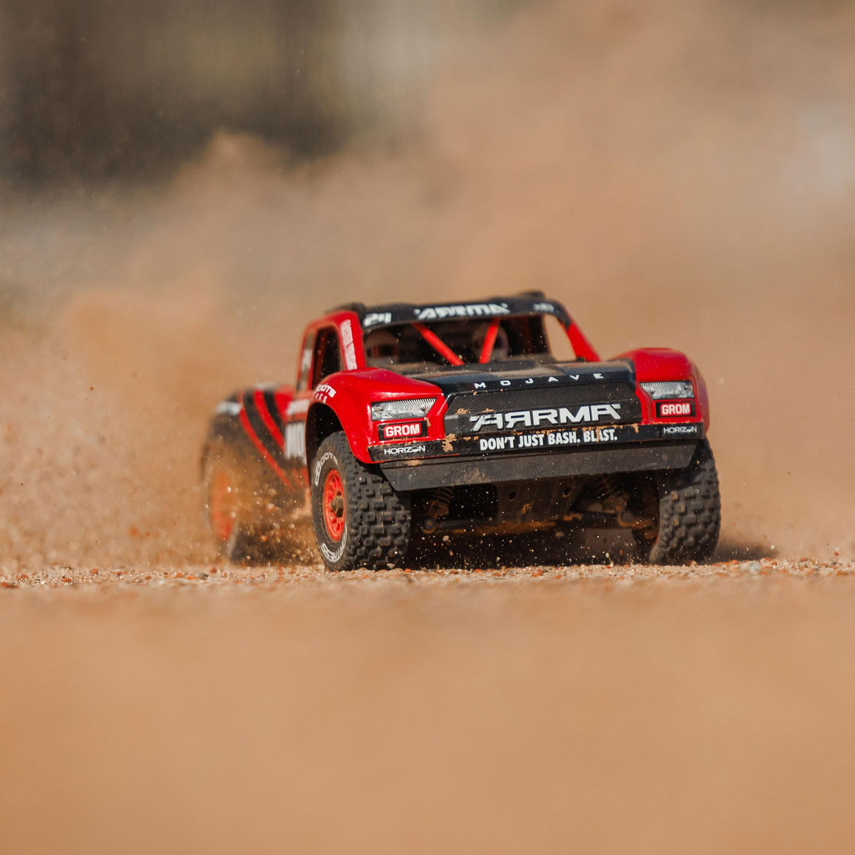 ARRMA Mojave GROM 4x4 on dirt demonstrating traction and control