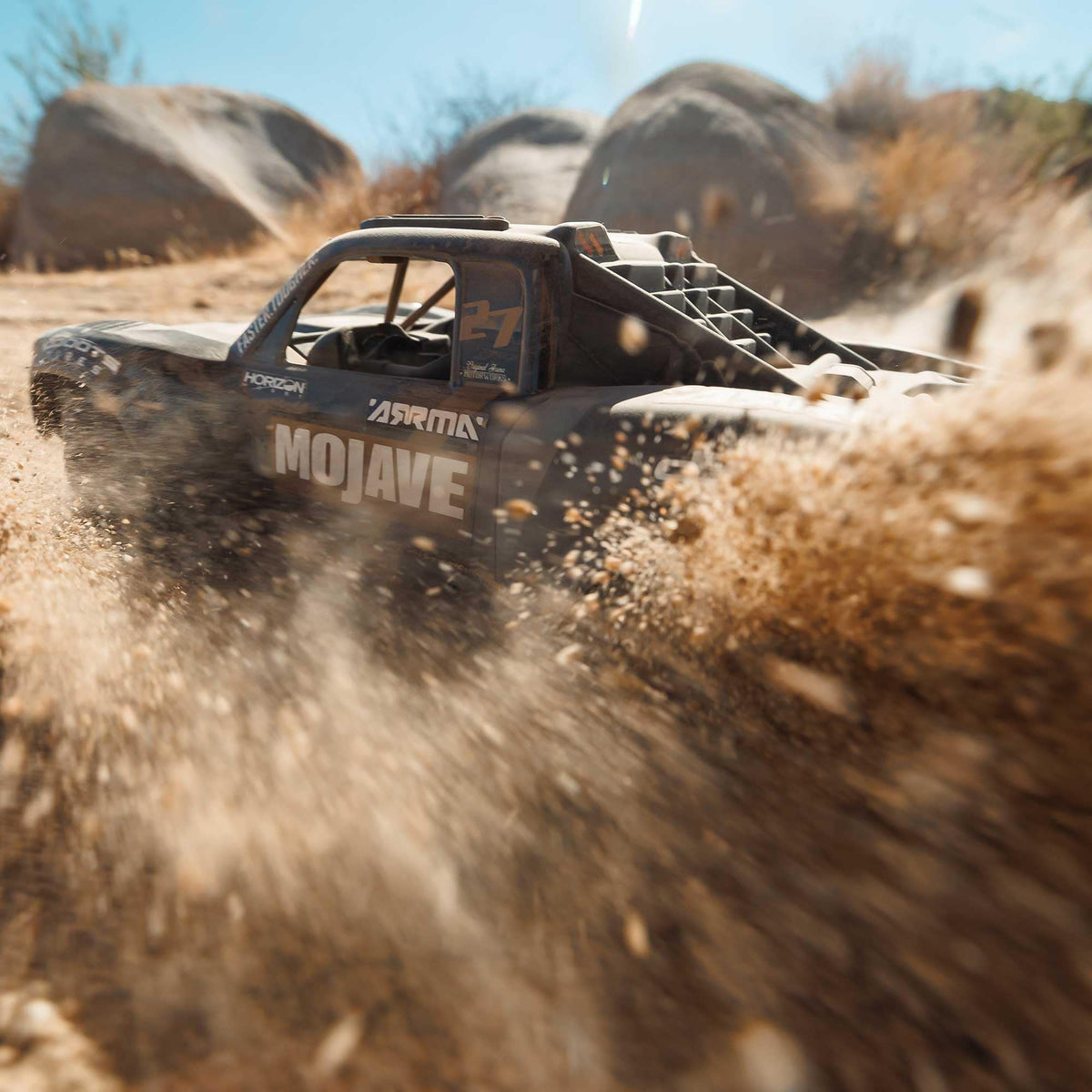 ARRMA Mojave GROM 4x4 rear view, durable RTR setup ready to tackle rough terrain.