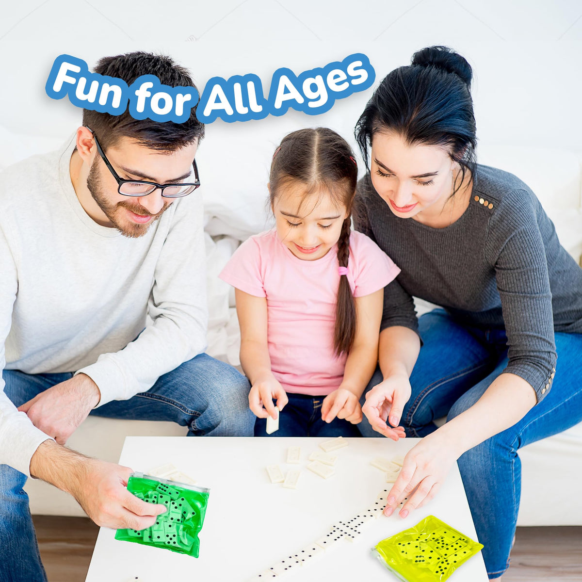 ArtCreativity family game night with dominoes on a table.