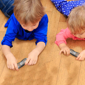 ArtCreativity slinky movement stairs play illustrates classic coil toy in motion down stairs.